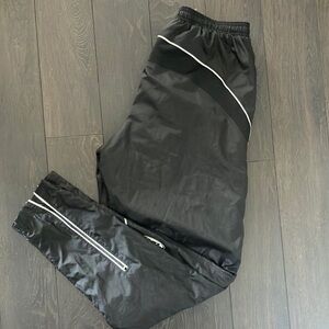 Women’s Louis Garneau Black Track Pants with reflective lines